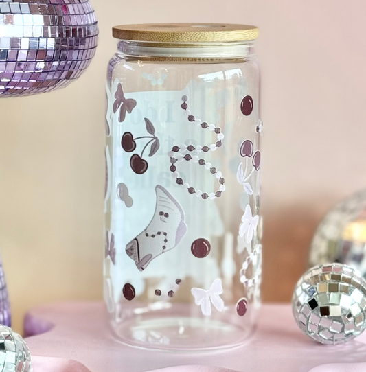 Decorative setup with a disco ball, glass jar, and colorful background
