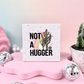 Not A Hugger Ceramic Coaster