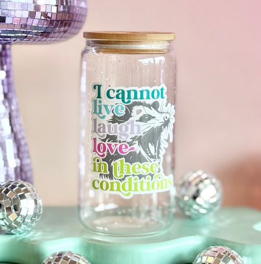 Glass jar with a motivational quote on a colorful background with disco balls and a disco mushroom.