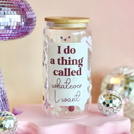 Decorative jar with a humorous quote on a pink stand with disco balls and a disco ball in the background.