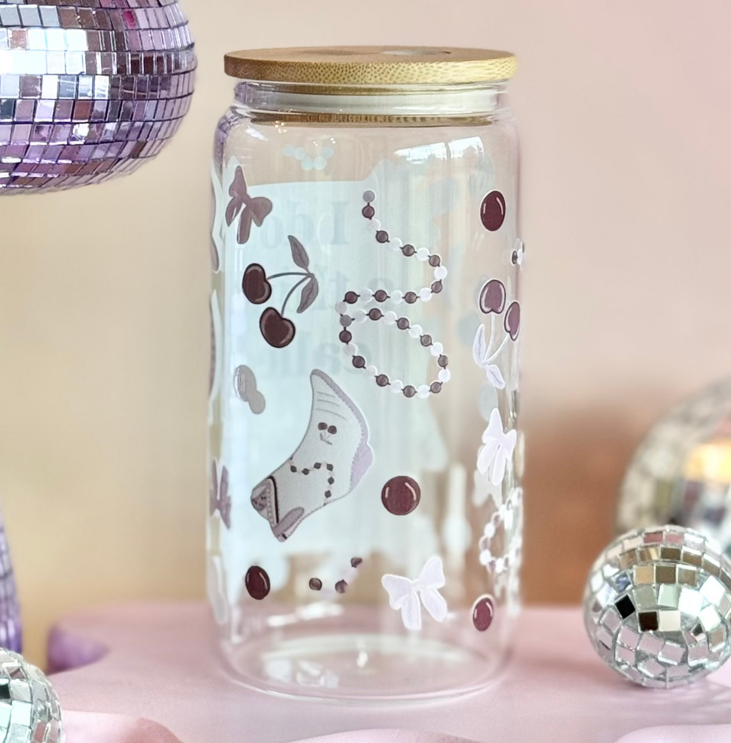 Decorative setup with a disco ball, glass jar, and colorful background